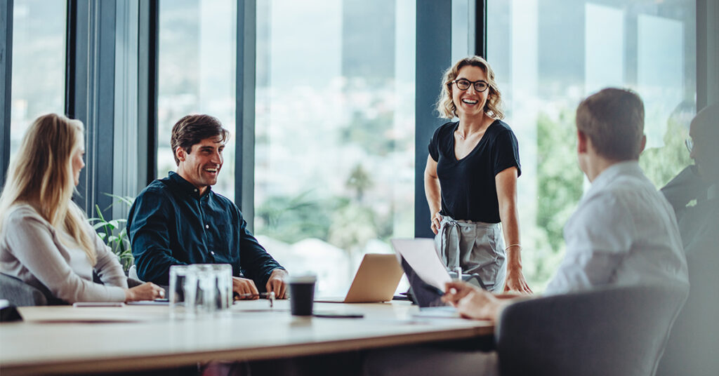 office-colleagues-having-casual-discussion-during-meeting-in-conference-room